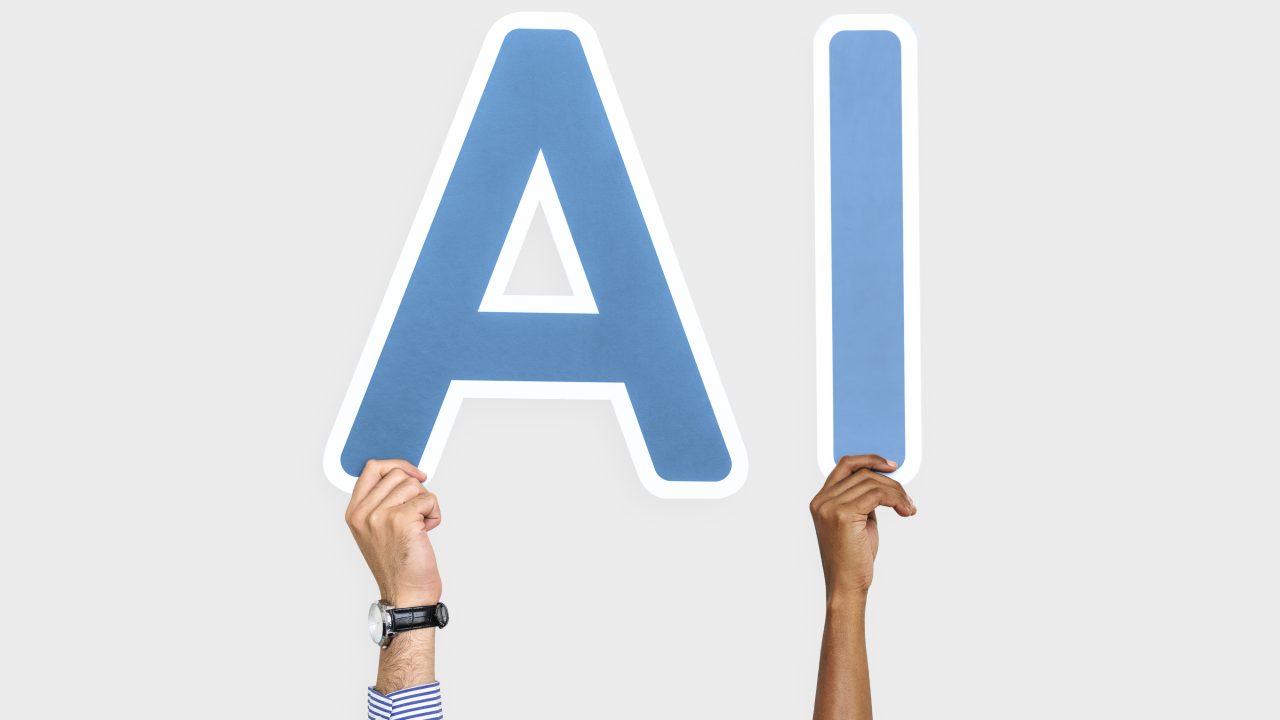 https://finandlaw.co.tz/wp-content/uploads/2025/09/hands-holding-up-blue-letters-forming-abbreviation-ai-1280x720.jpg