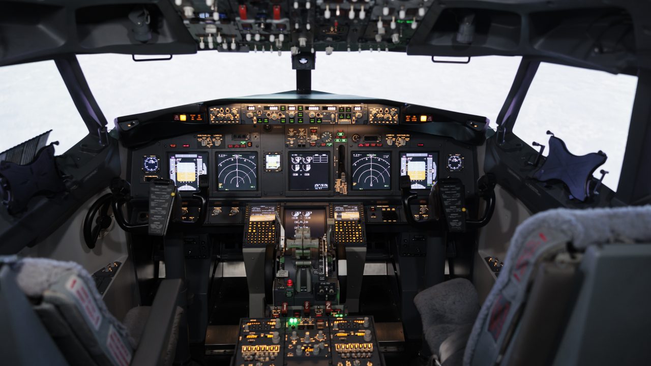 https://finandlaw.co.tz/wp-content/uploads/2025/10/empty-airplane-cockpit-with-electronic-flying-navigation-panel-control-command-with-buttons-lever-dashboard-no-people-aircraft-cabin-throttle-engine-takeoff-1280x720.jpg